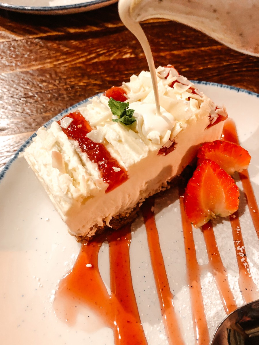 Cream pouring on cheesecake at Navigation Stoke Bruerne 