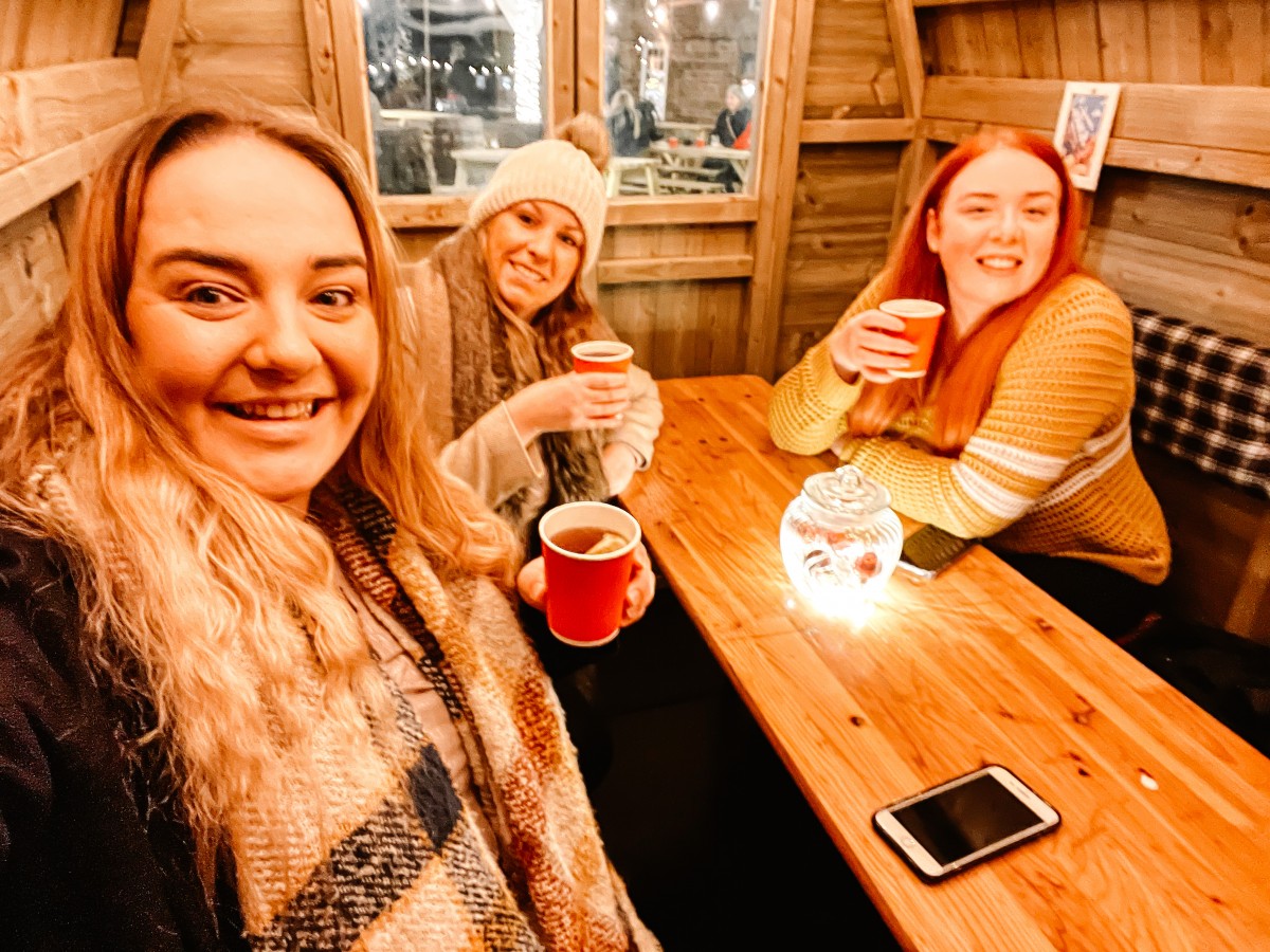 Nicole and her friends drinking mulled cider at The Northampton Winter Light Trail at Delapré Abbey 