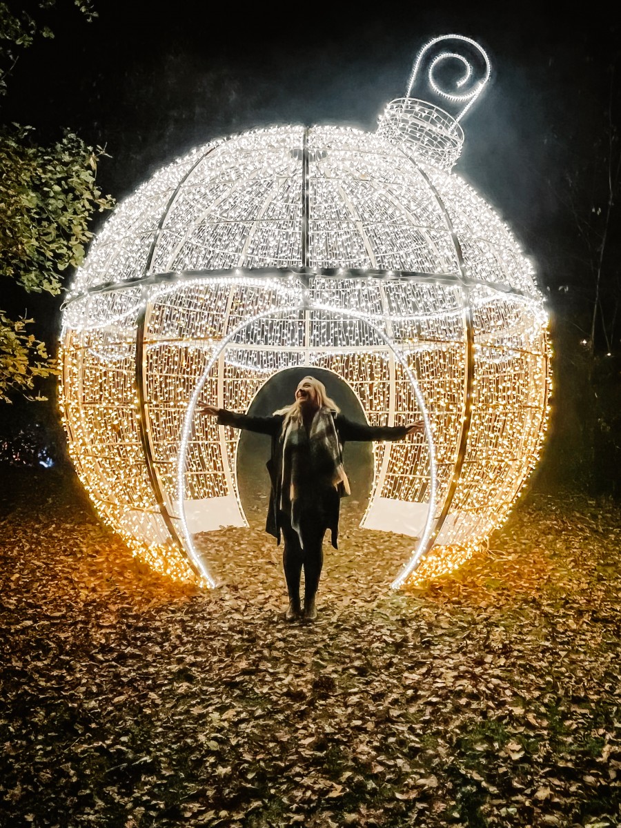 Nicole Navigates inside a light up bauble at The Northampton Winter Light Trail at Delapré Abbey 